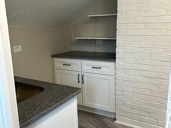 Kitchen with new countertops, new sink, new flooring