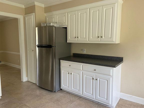 Kitchen with a stainless steel fridge.
