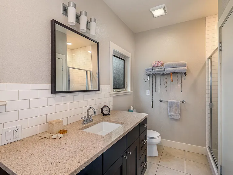 Bathroom with shower and washer dryer combo