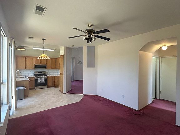 Family room looking toward kitchen. Garage, Laundry and 1/2 bath are at right side of picture