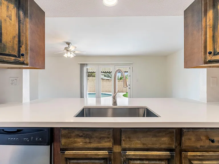 Kitchen Looking out to Dining Room and Pool