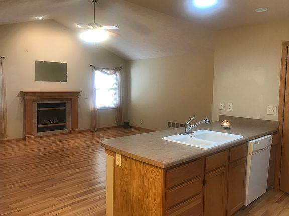 The open floor plan allows anyone in the kitchen to see the living room.
