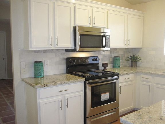 New stove, microwave, dishwasher, granite counter tops, Carrara marble tile back splash