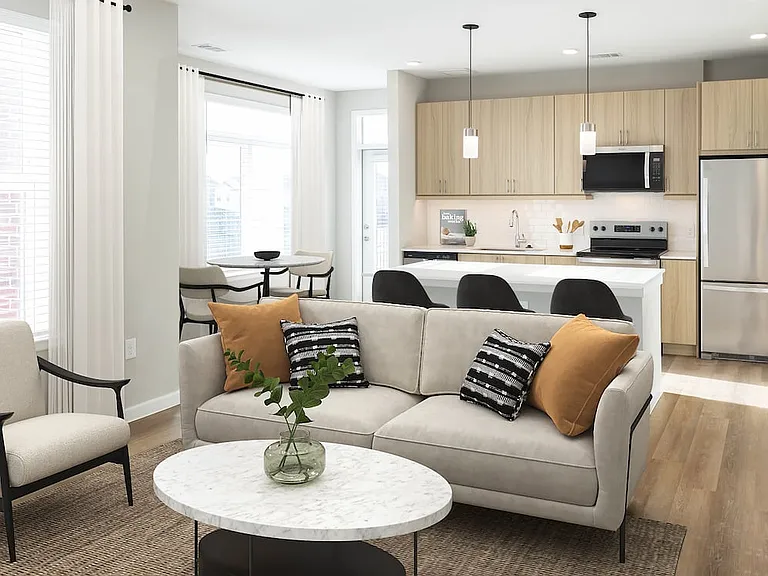 Finish Package II kitchen with stainless steel appliances, oak cabinetry, white tile backsplash, white quartz countertop, and hard surface flooring