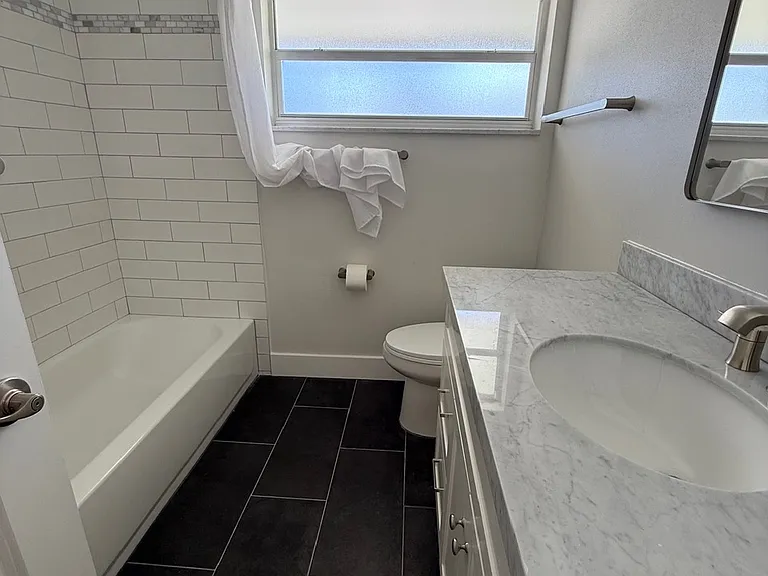 Hallway full bath, tub and shower