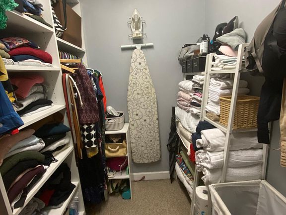 Walk in closet with California closet system