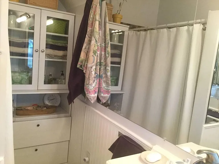 NOW the phots do not show it. - - - -- But, this newer remodeled LARGE Bath Room accomodates TWO PEOPLE while getting ready for the day.