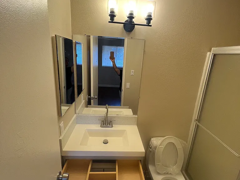 The primary bedroom features its own private en-suite bathroom for added comfort and convenience.