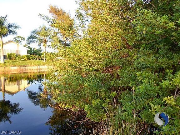 Property is to the right looking across the canal to another home.