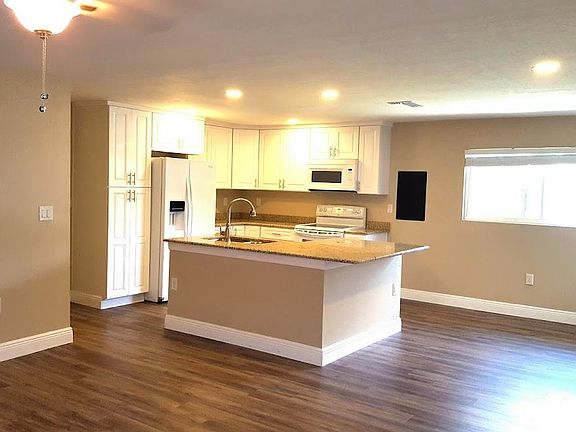 Wonderful open floor plan! View of kitchen from living area dining area to left. A cook's dream kitchen!