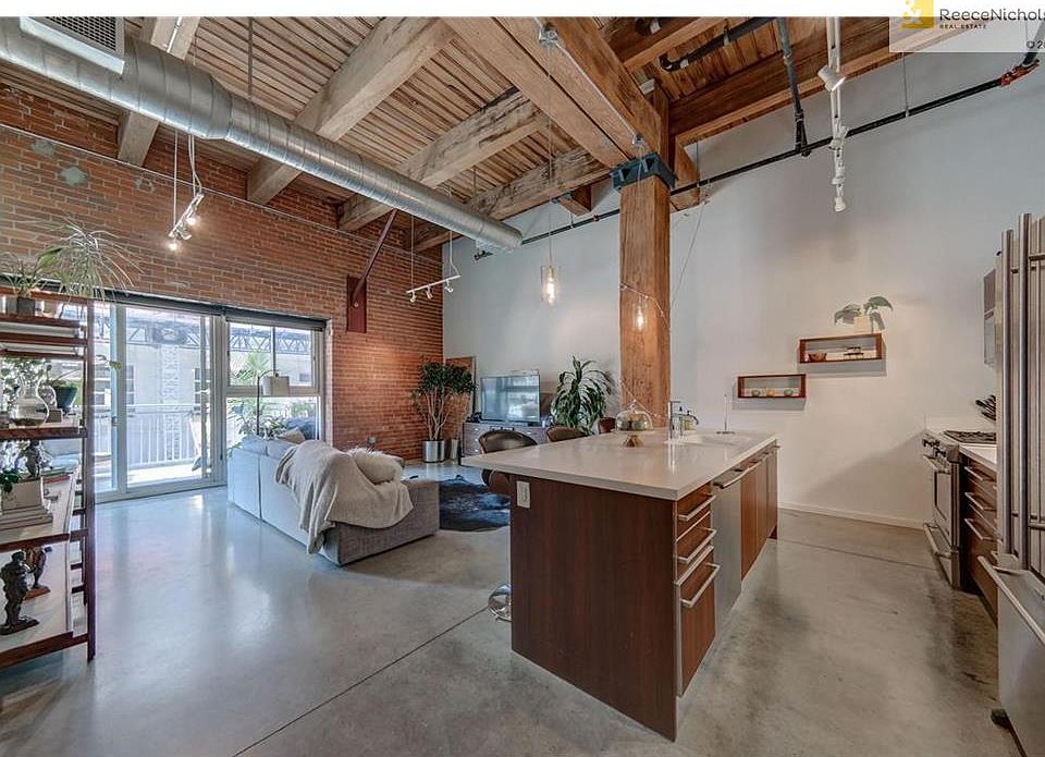 View walking in front door. Open, modern floor plan.
