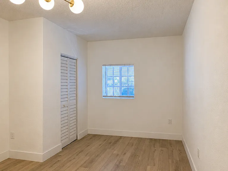 Main living and sleeping area featuring a built-in closet, natural light, and its own mini-split A/C.