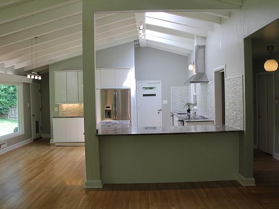 Open concept kitchen, dining and living room.