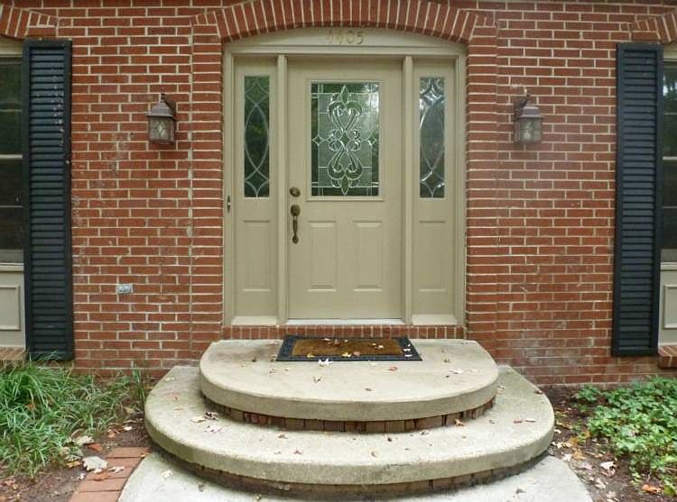 Walk up the paver-edged walkway to a well-appointed front entry with newer door!