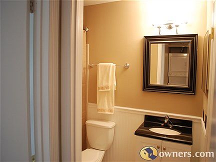 Updated Full Bath w neutral decor, wainscoting,