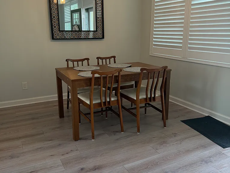 Table and 4 chairs in dining. Shutters throughout. New hurricane windows.