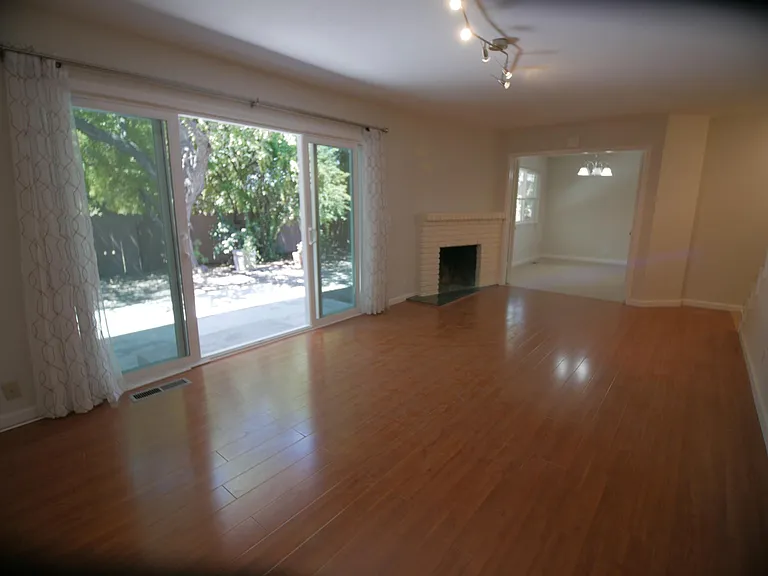 View of living room with sliding door and fireplace