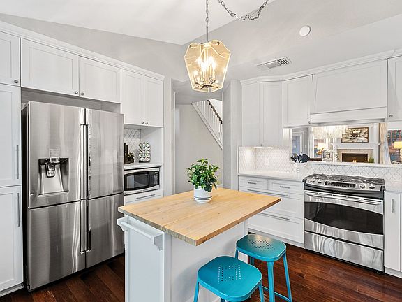 Fully stocked kitchen with island bar