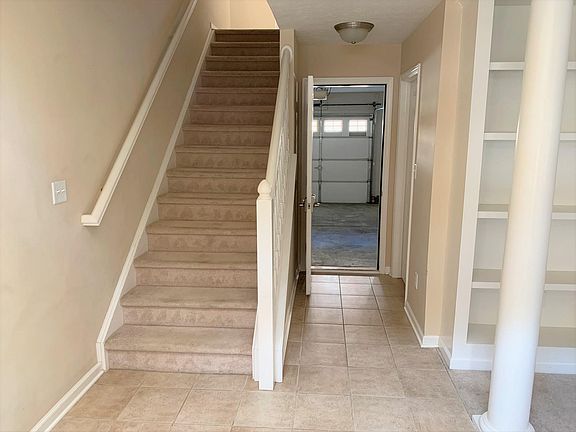 stairs to living space on 2nd floor. Office/Den and Half bath on 1st floor