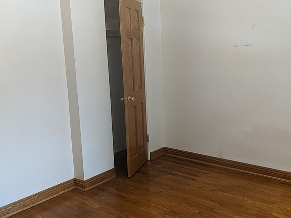 Third bedroom hardwood floors oak trim and doors