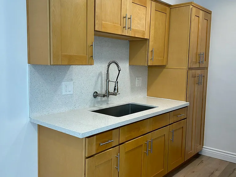 Brand new designer kitchen cabinets with stainless steel kitchen sink and faucet