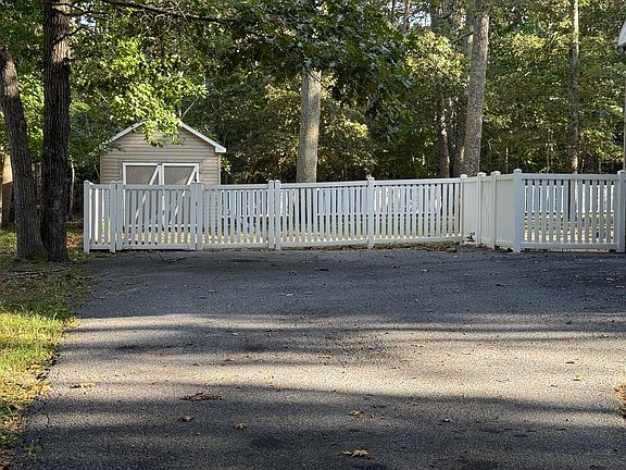 large fenced yard with bonus detached garage