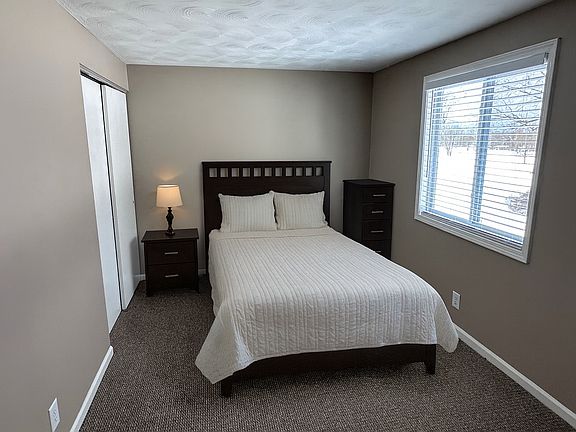 Bedroom 1 of 3. All bedrooms have closets. All bedrooms have been freshly painted with new carpeting and new wood faux blinds