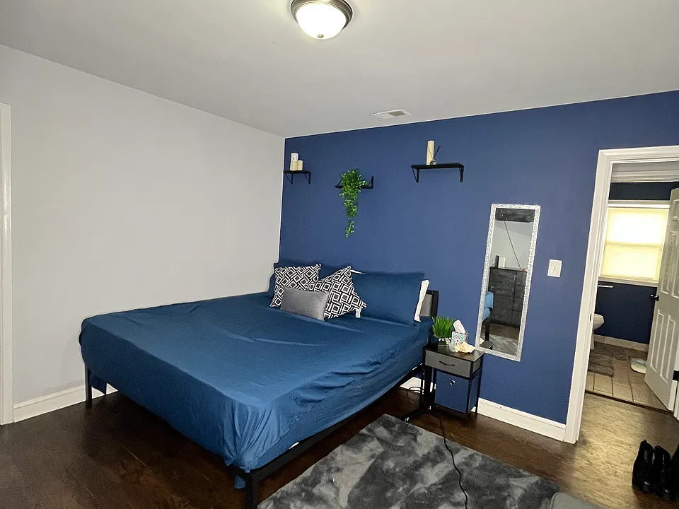 king sized bed with a walk-in-like closet