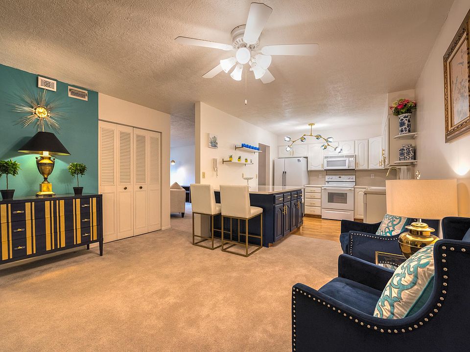Entry sitting area and updated kitchen with brand new quartz island and bar seating.