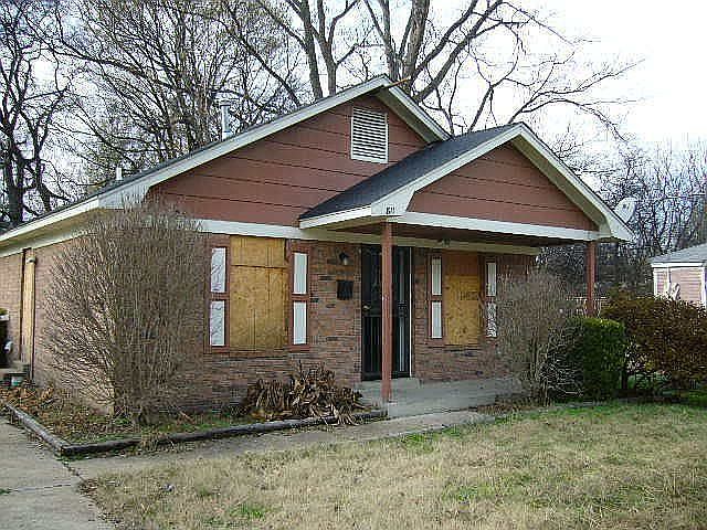 Brick Home. Windows covered to protect glass. 