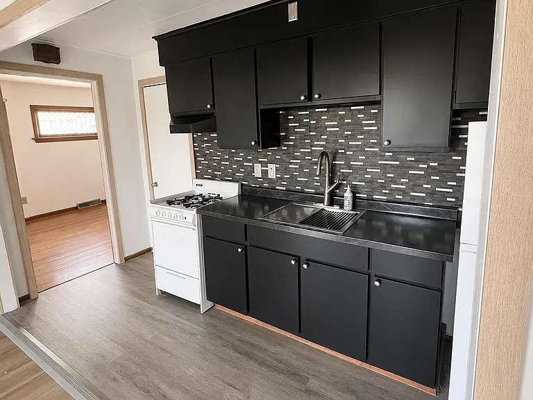 The Kitchen features a brand new countertop with a deep basin sink, to make cooking and cleaning a breeze.