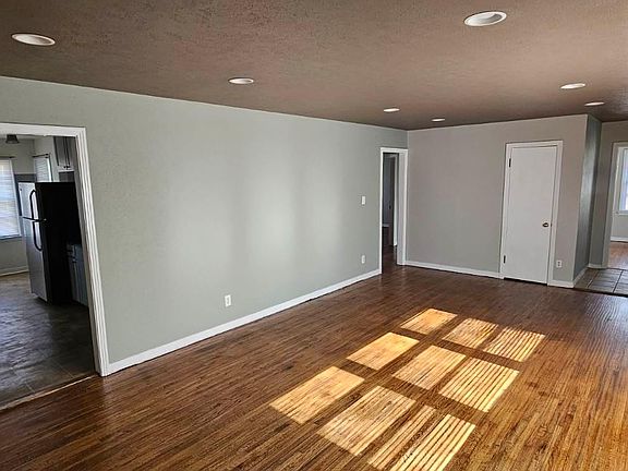 Living area. Newly refinished hardwood flooring.