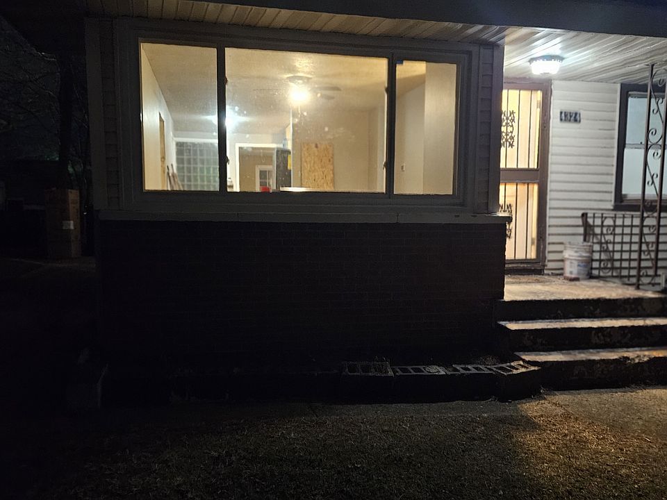 The front of the property features a prominent and impressive window and motion detection surface the house.