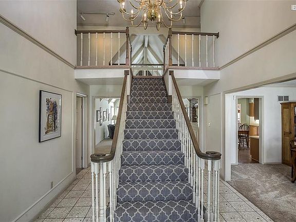 TILED ENTRY WAY, NEW CARPET ON STAIRS AND ON FIRST FLOOR