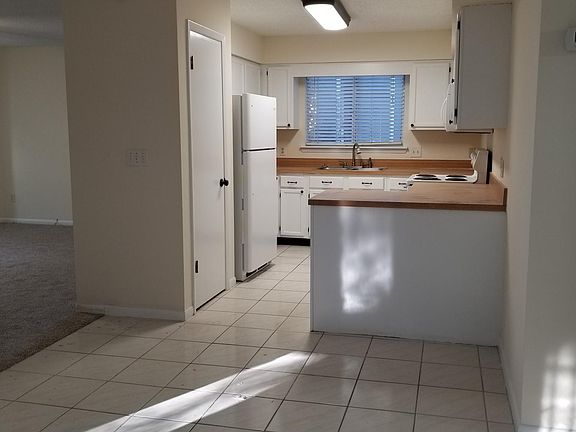 Large kitchen with new refrigerator