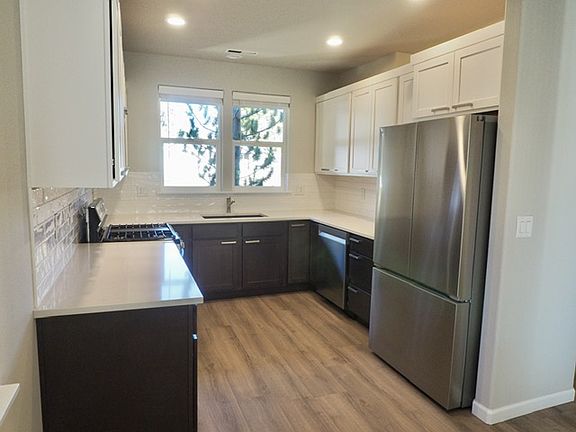 New LVP flooring, soft-close cabinets, quartz countertops and Stainless appliances throughout home.