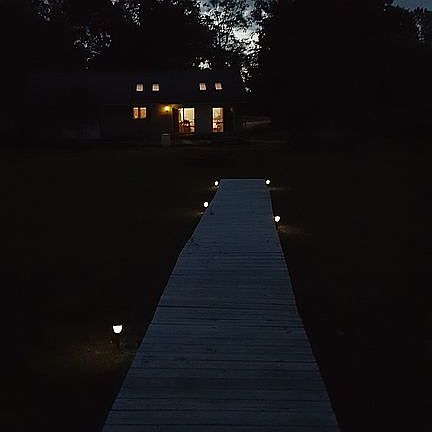 Dock to house at night