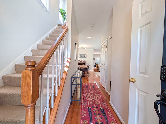 Entrance into the foyer - powder room is on the right