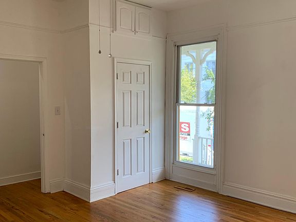 Bedroom #1 is at the front of house. This view shows closet and one of two windows to front porch.