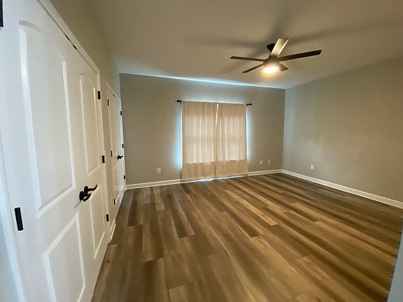 Master bedroom - on left 2 sets of doors are to one large combined closet and 3rd set of doors is to an additional separate closet.