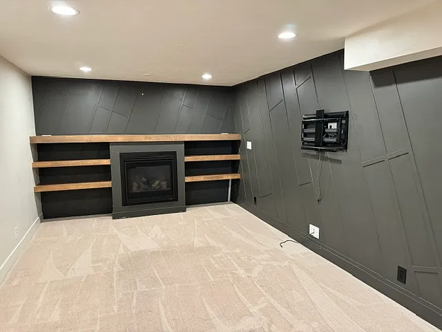 Basement TV mount, shelves, fireplace