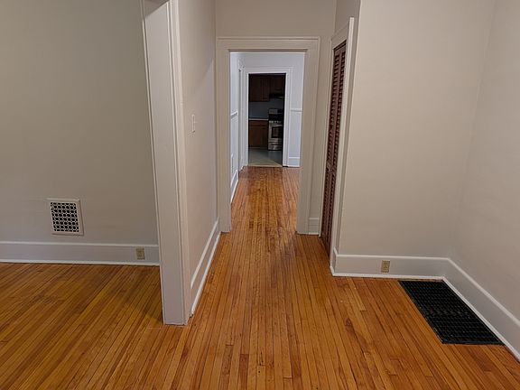 Entrance, foyer, closet, living room on left, dining room and kitchen straight ahead