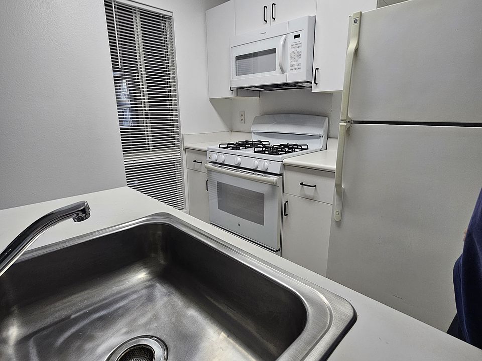 Sink has garbage disposal. New microwave.