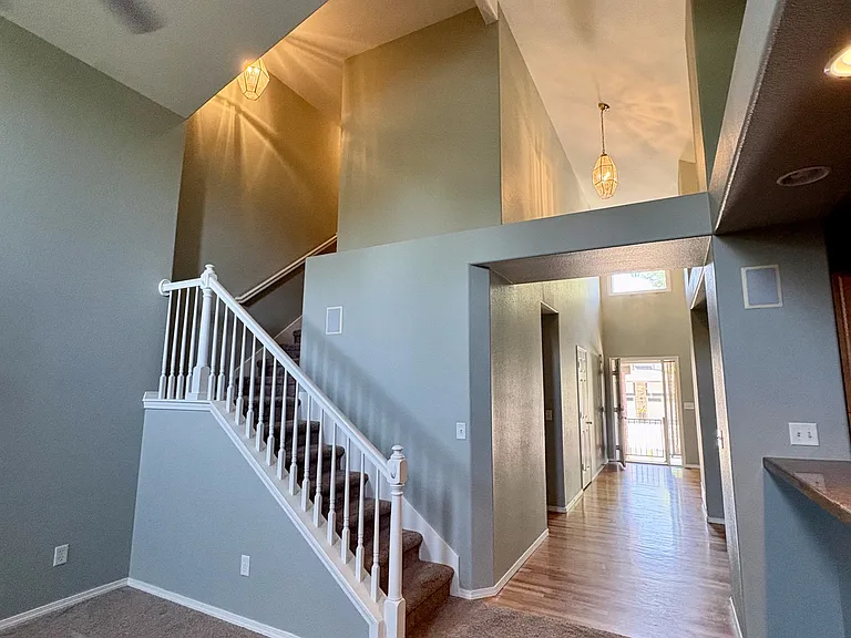 Living room showing stairs to second level.