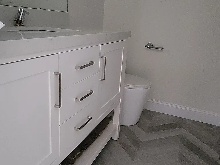 2nd bathroom with new vanity and toilet