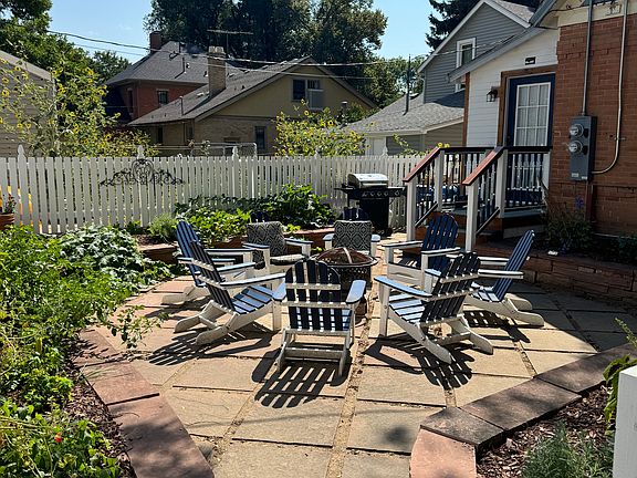 Garden area with fire pit and barbecue that will be shared by homeowner and tenant