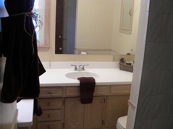 Updated bathroom with tiled floors and new counters tops