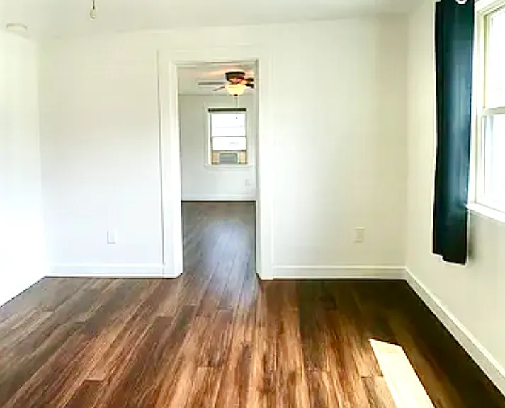 Secondary bedroom serves as a connector to the primary bedroom and the living room. Great OFFICE space!