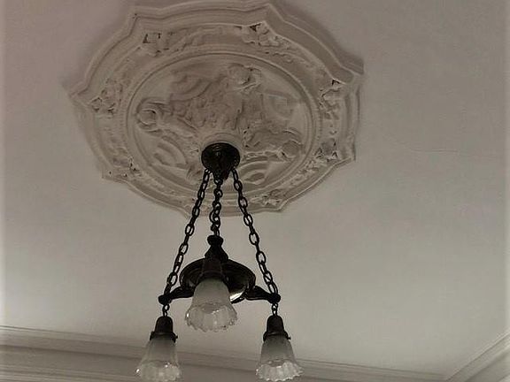 There are lovely ceiling medallions like this throughout the flat