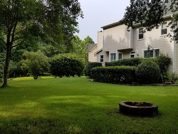 Large backyard with firepit